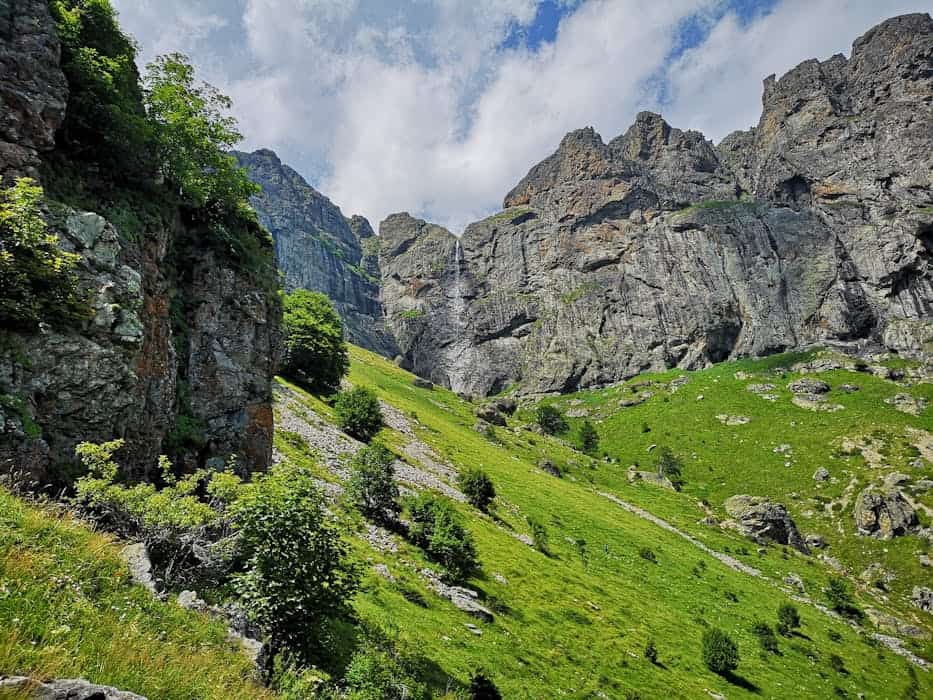 Scenic grassy slopes and towering rock formations in Plovdiv Province, Bulgaria.